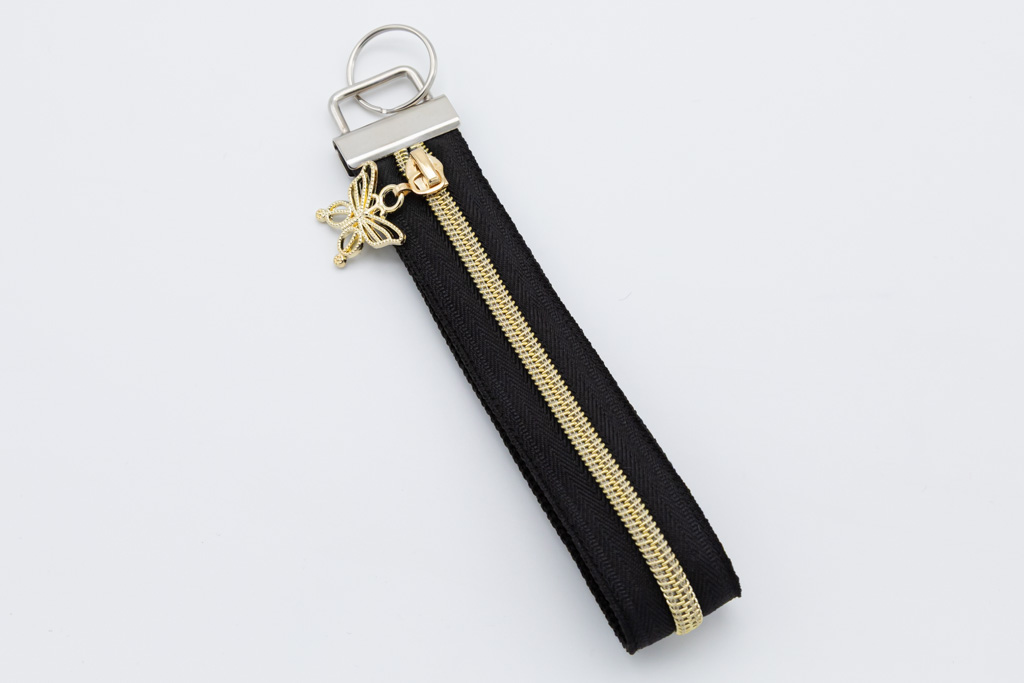 Schlüsselband mit Geheimfach schwarz/gold